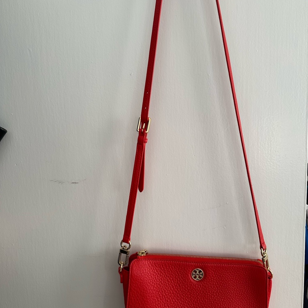 Vibrant Red Crossbody Bag with Leather Texture and Compact Size